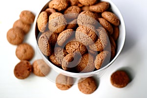 Italian amaretti bisquits on a white backdrop