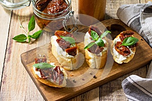 Italian Antipasti snacks for Wine. Brushetta with Soft Cheese and Dried Tomatoes