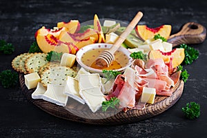 Italian antipasto catering platter with prosciutto, cheese and fruit