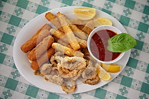 Italian appetizer combination plate with mozzarella sticks,fried calamari and zucchini