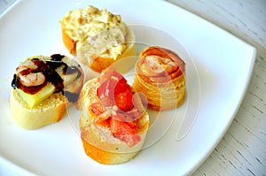 Italian appetizer, finger food on a white plate photo