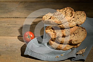 Italian appetizer Friselle. Apulian dried bread Friselle in wooden background