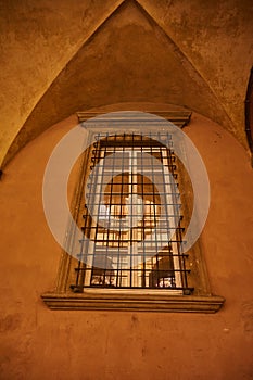 Italian barred window on the wall