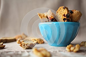 Italian biscotti cookies with nuts on the table with grey linen tablecloth