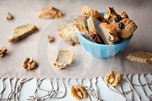 Italian biscotti cookies with nuts on the table with grey linen tablecloth