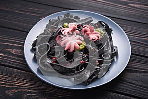 Italian black pasta with cuttlefish ink and marinated octopus