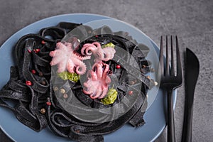 Italian black pasta with cuttlefish ink and marinated octopus