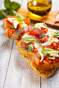 Italian bruschetta bread with tomato, basil and mozzarella cheese