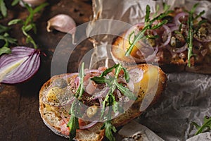 Italian bruschetta with chopped onion and fish