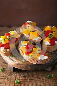 Italian bruschetta with roasted peppers goat cheese olives