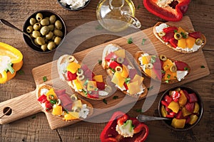 Italian bruschetta with roasted peppers goat cheese olives