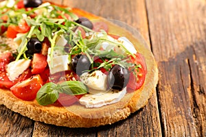 italian bruschetta with tomato, olive, cheese