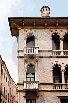 Italian building with balconies and molding