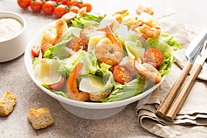 Italian Caesar salad with shrimp, croutons and parmesan