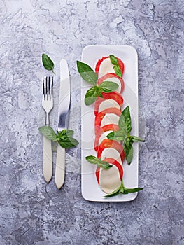 Italian caprese salad with mozzarella, tomatoes and basil