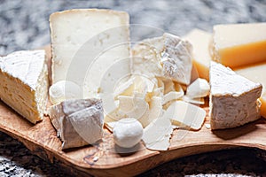 Italian cheese plate. Assorted with top italian cheeses - Camembert, Parmesan, Mozzarella and Pecorino