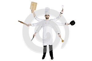 Italian chef holding kitchen utensils on studio