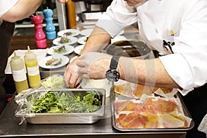 Italian chef prepares salad