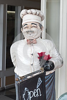 Italian chef statue, restaurant open sign