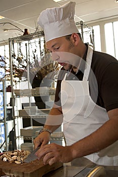 Italian chef; whistling at the job