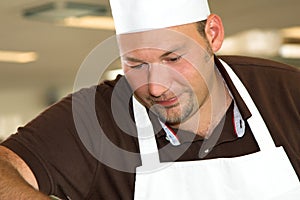 Italian chef working concentrated