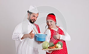 Italian Chief cook in Red Apron and Handsome Cook are Showing Nu photo