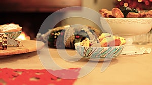 Italian Christmas cakes served on a shine and warmth table with a chimney background. k41 SF