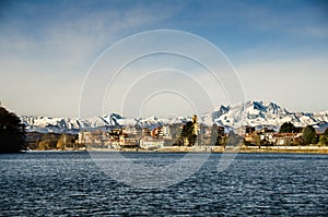 Italian city Sesto Calende on the shore of a river and mountains in front of the Alps mountains