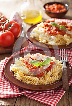 Italian classic pasta fusilli with tomato sauce and basil