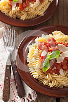 Italian classic pasta fusilli with tomato sauce and basil