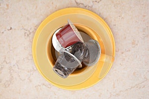 Italian coffee capsules in cup on table photo