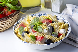 Italian cold pasta salad or Pasta fredda alla caprese. Directly above. Fusilli, tomato, mozzarella, olive, arugula. Turkish name