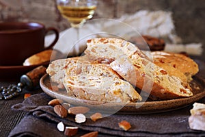 Italian cookies: almond and candied orange cantuccini biscotti, coffee and glass of white wine