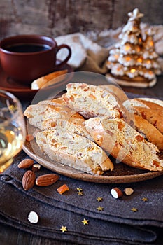 Italian cookies: almond and candied orange cantuccini biscotti,  New Year decoration on wooden background