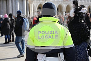 italian cop with uniform with the text POLIZIA LOCALE which mean