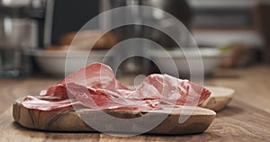 Italian coppa ham on wood board closeup