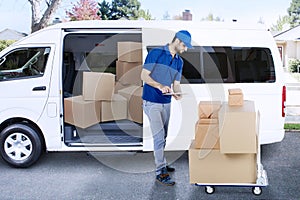 Italian courier is checking package in the road