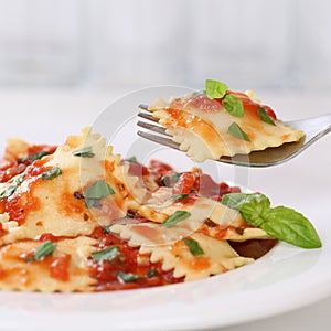 Italian cuisine eating Ravioli with tomato sauce meal