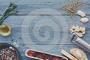 Italian cuisine ingredients background on blue rustic wood, copy space