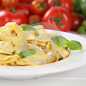 Italian cuisine pasta Tortellini noodles meal with tomatoes on p