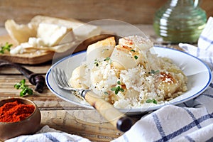 Italian cuisine. Plate of scallop risotto, olive oil and parmesan cheese