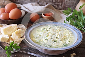 Italian cuisine. Stracciatella soup: parsley, eggs and parmesan cheese