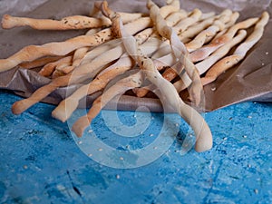 Italian cuisine. Traditional Italian gresini bread sticks with sesame seeds. Delicious bread appetizer