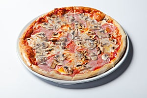 Italian delicious pizza with mushrooms and ham.