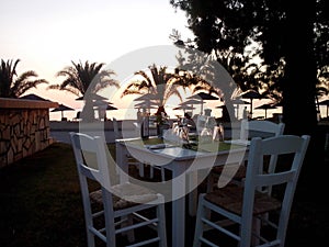 italian diner table sunset at porto carras resort