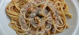 Italian dish of spaghetti with clams and tomato