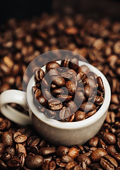 Italian espresso cup of coffee beans with coffee background