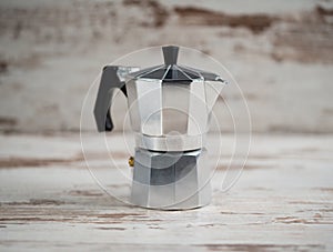 Italian espresso machine over wooden background