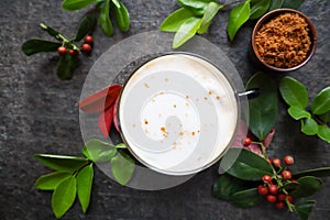 Italian espresso with milk with green decoration photo