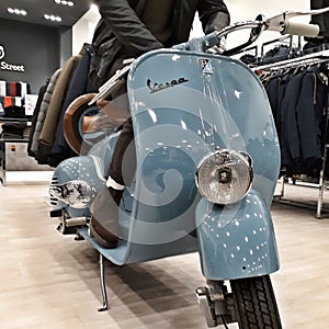 Italian famous scooter in a dress shop.